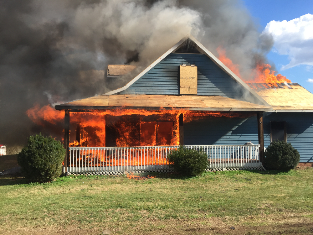 House engulfed in flames and smoke