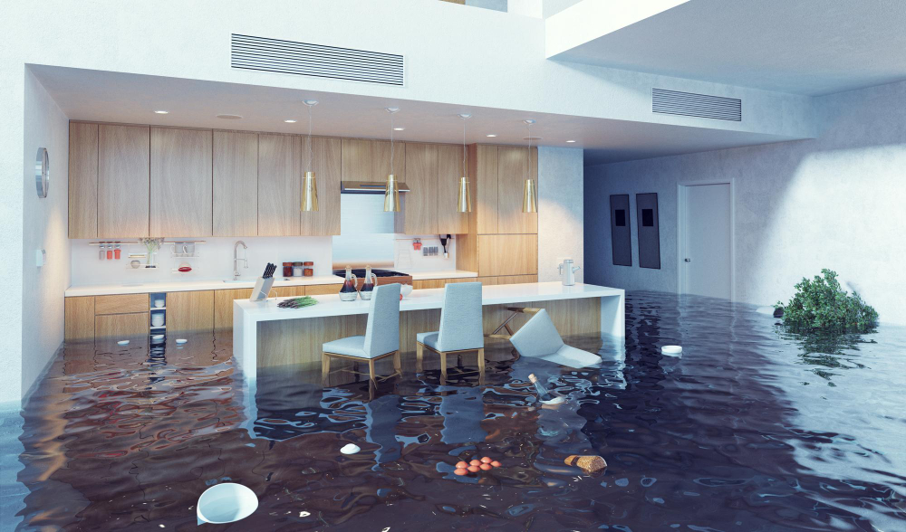 Flooded modern kitchen with floating debris.