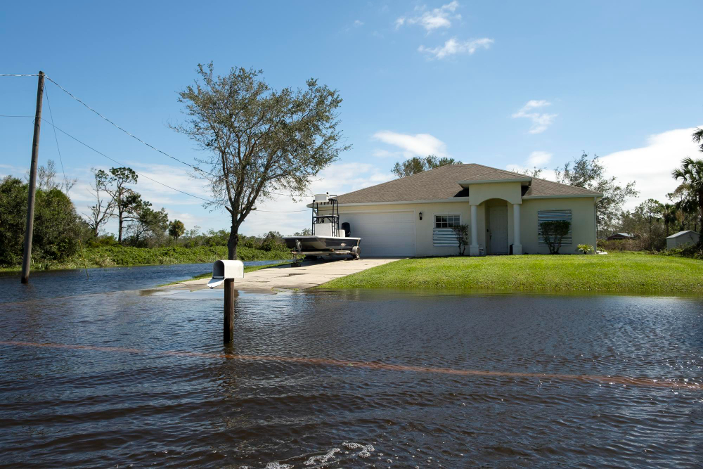 Flooded street in front of suburban house