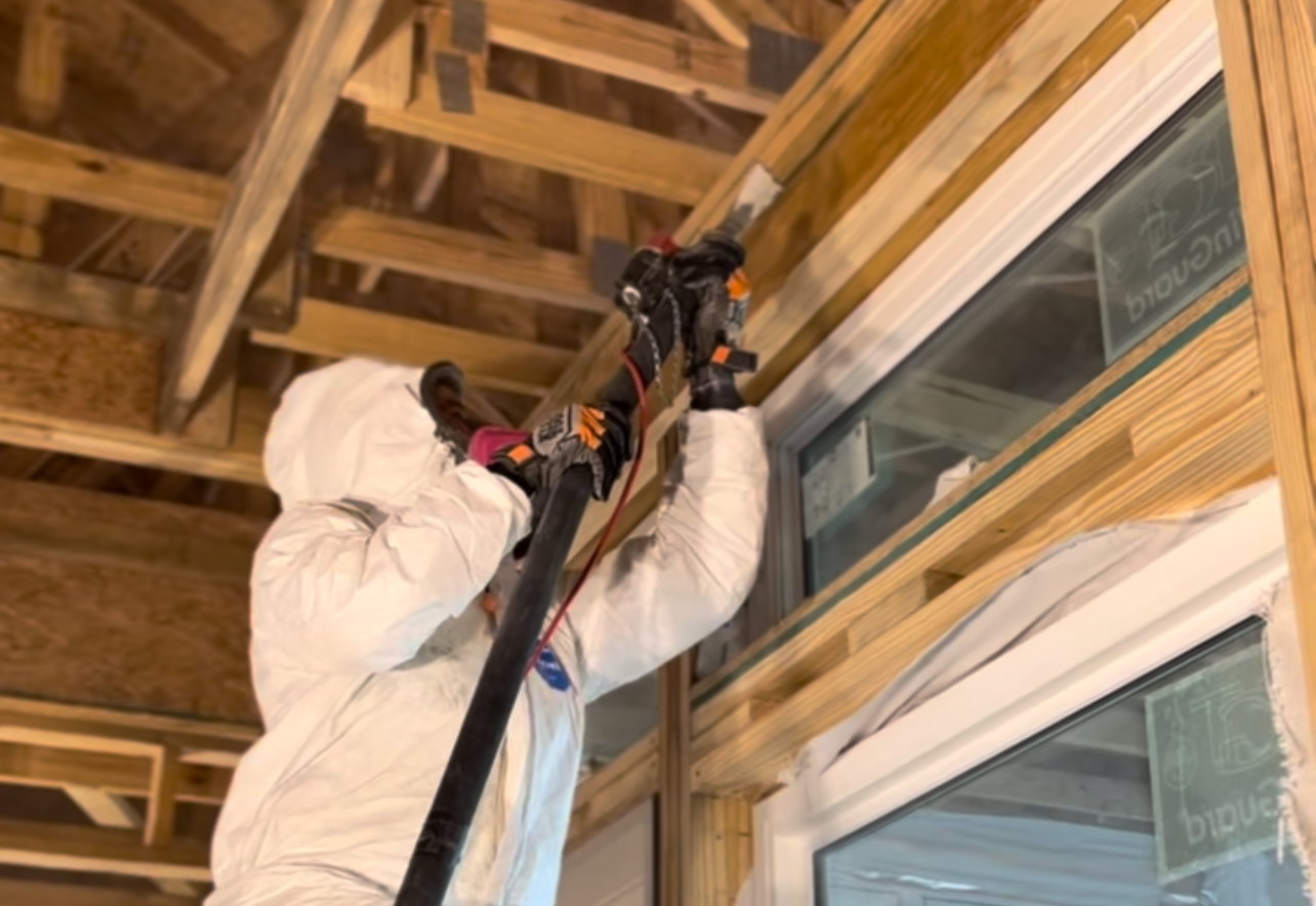 Worker cleaning with soda blasting