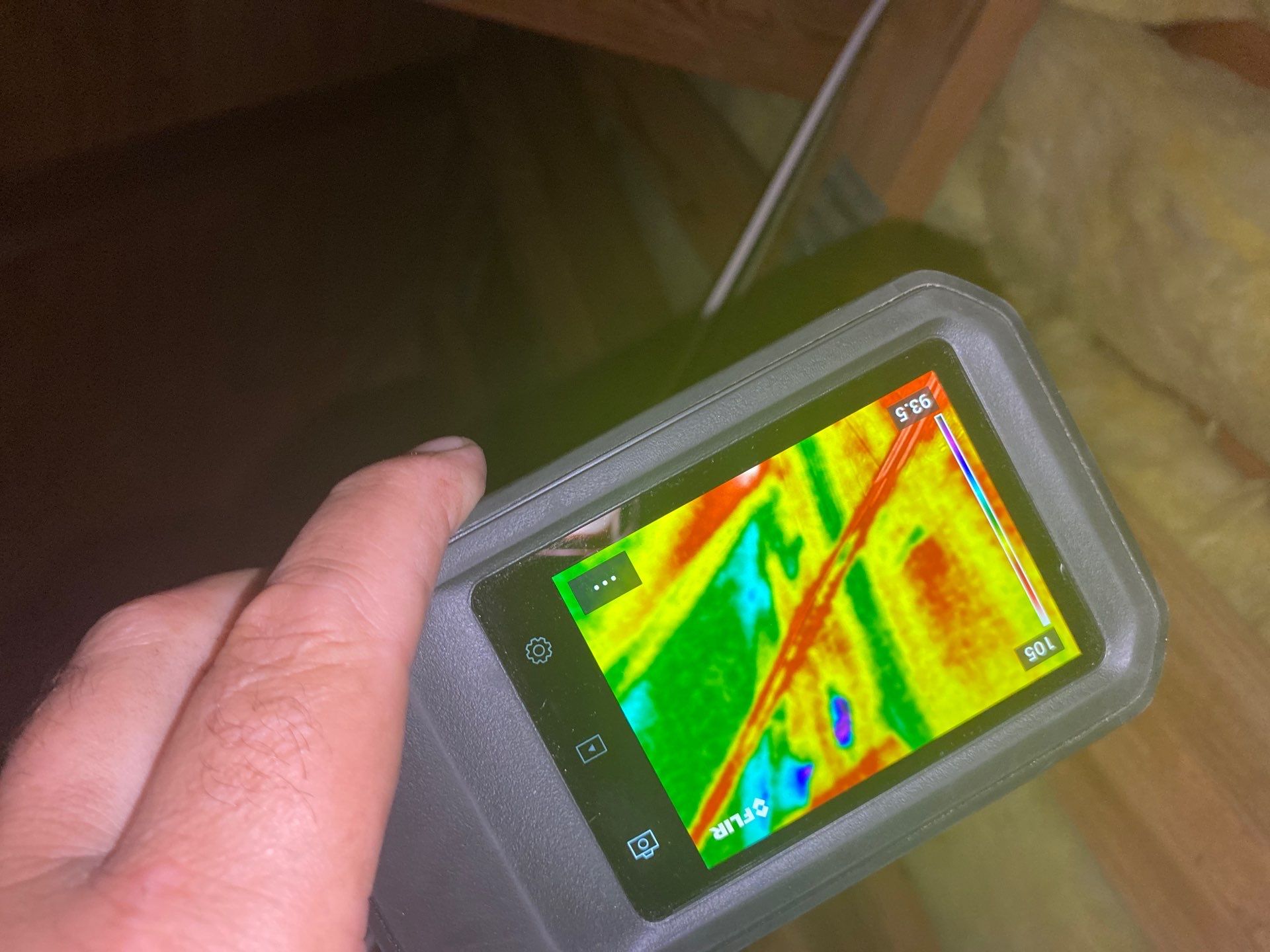 Thermal camera displaying colorful heat map.